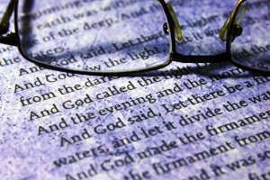 Reading glasses on bible text