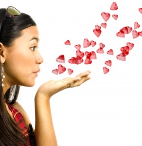 Girl Blowing Red Hearts To Her Lover For Valentines